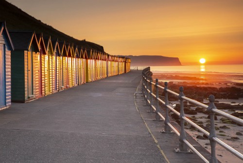 Beach huts and the sunset at Whitby